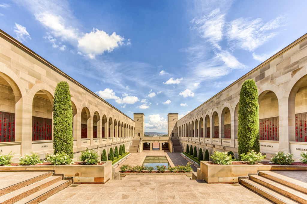 The comemorative area of the Australian National War Memorial features the Pool of Reflection and the Eternal Flame in honour of those who served for Australia and New Zealand.