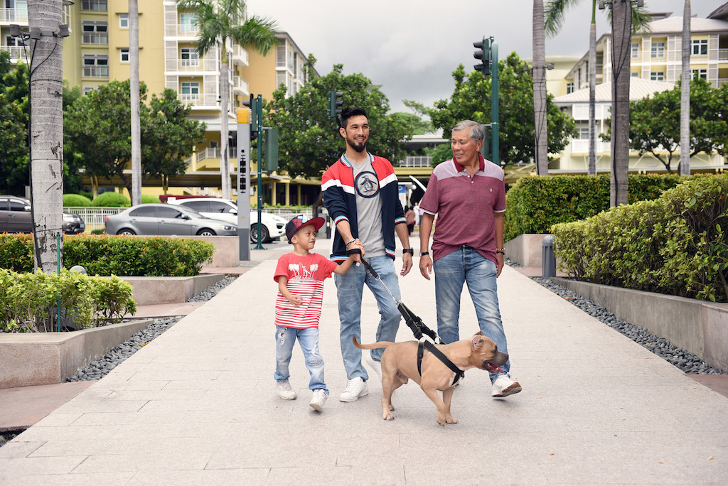 Miles Del Rosario in a kids tee and Retro Sports Baseball Cap, Anton Del Rosario in a Circle Logo Tee and Retro Sports Jacket, Mariano Del Rosario in a Striped Polo