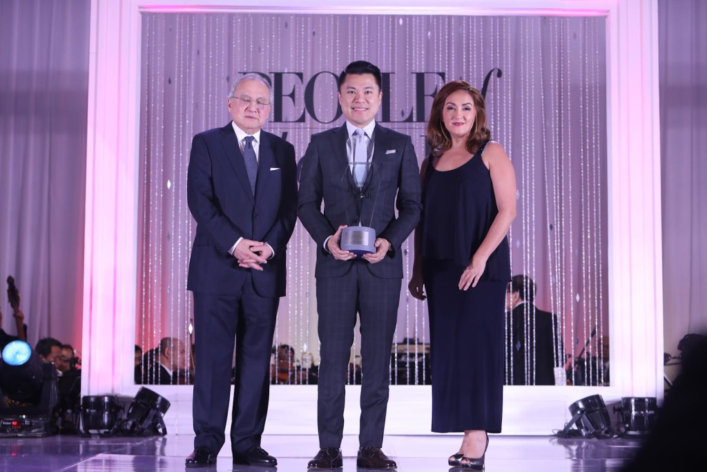 Kevin Tan receives his award from Ambassador Romualdez and Sara Soliven de Guzman