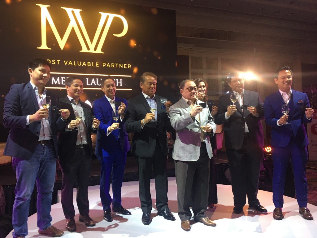 Manny V. Pangilinan, chair and CEO of PLDT and Smart, and the rest of his team during the MVP Rewards Card's launch at Makati Shangri-La