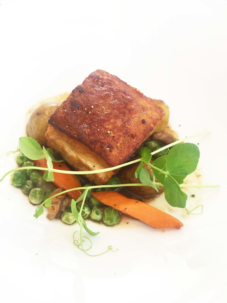 The slow-cooked pork belly is crunchy on the outside, tender on the inside