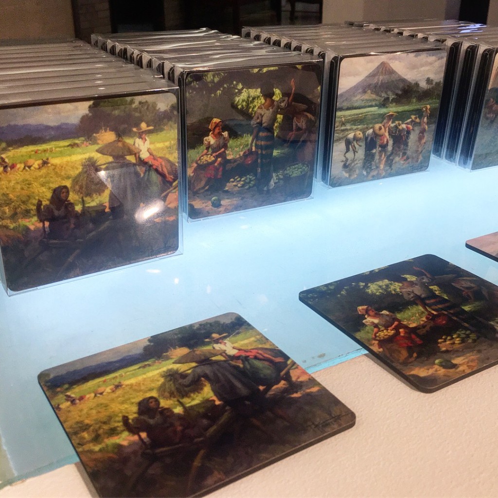 A set of coasters featuring Amorsolo's iconic countryside paintings
