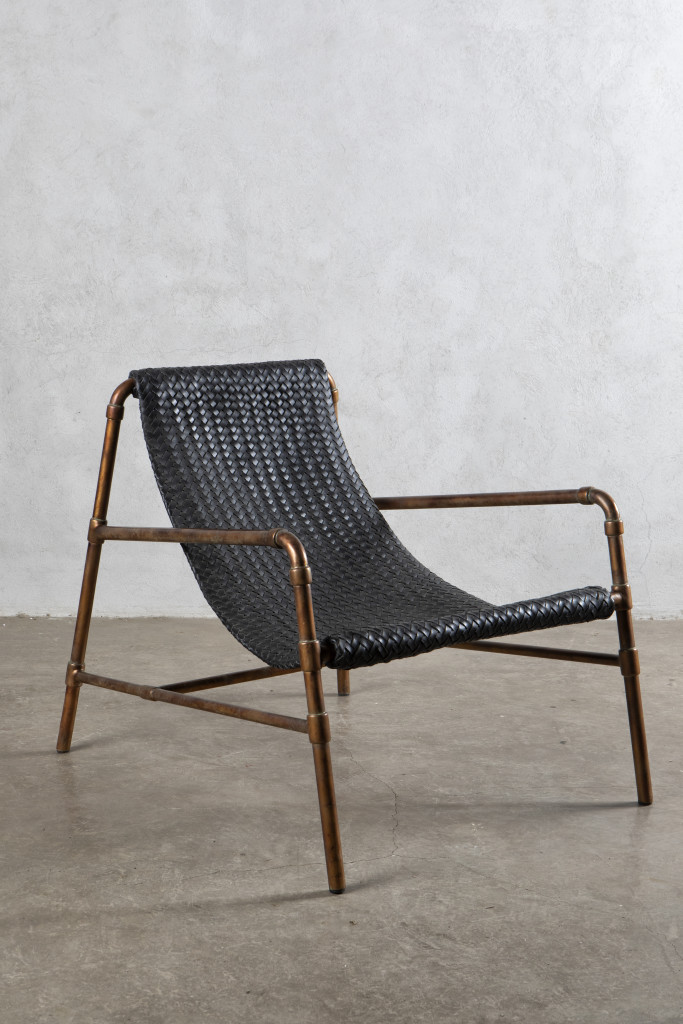 Lilliana Manahan's Umpire chair combines hard and soft elements in the form of metal tubing made to look like copper and sturdy woven leather.