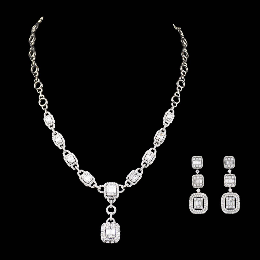 An impressive set of 10.76 tcw diamond dangling earrings and necklace set in 18k white gold