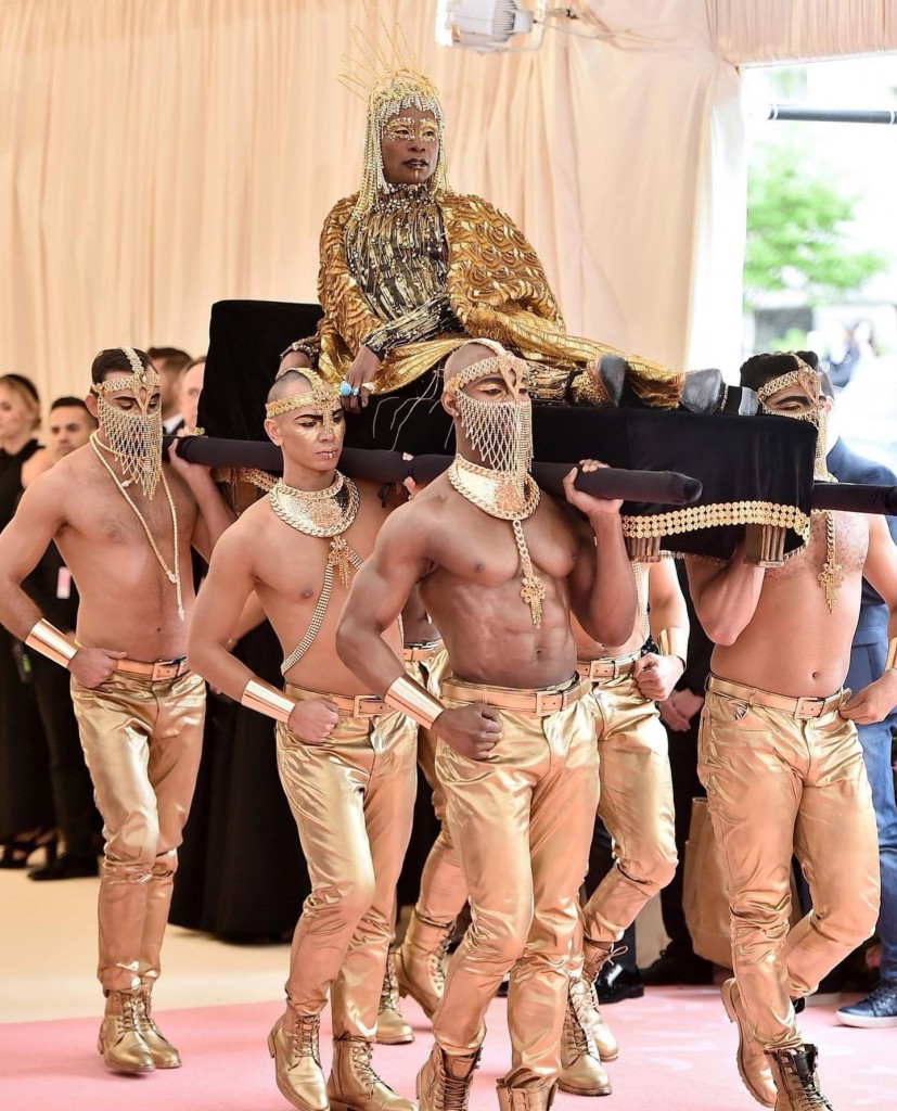 This is how you make an entrance. Billy Porter came fully dressed in a gold bodysuit and robe by The Blonds