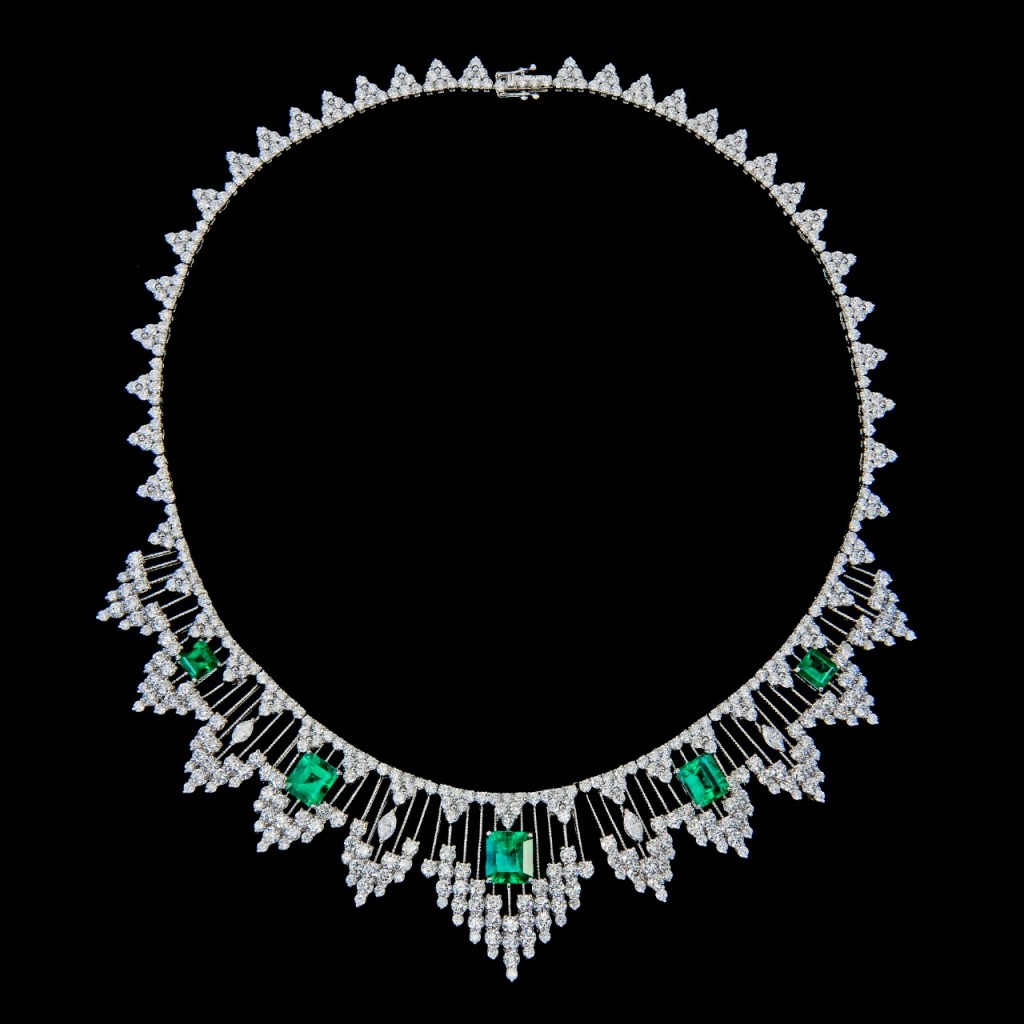 An impressive emerald and diamond necklace set in 18k white gold