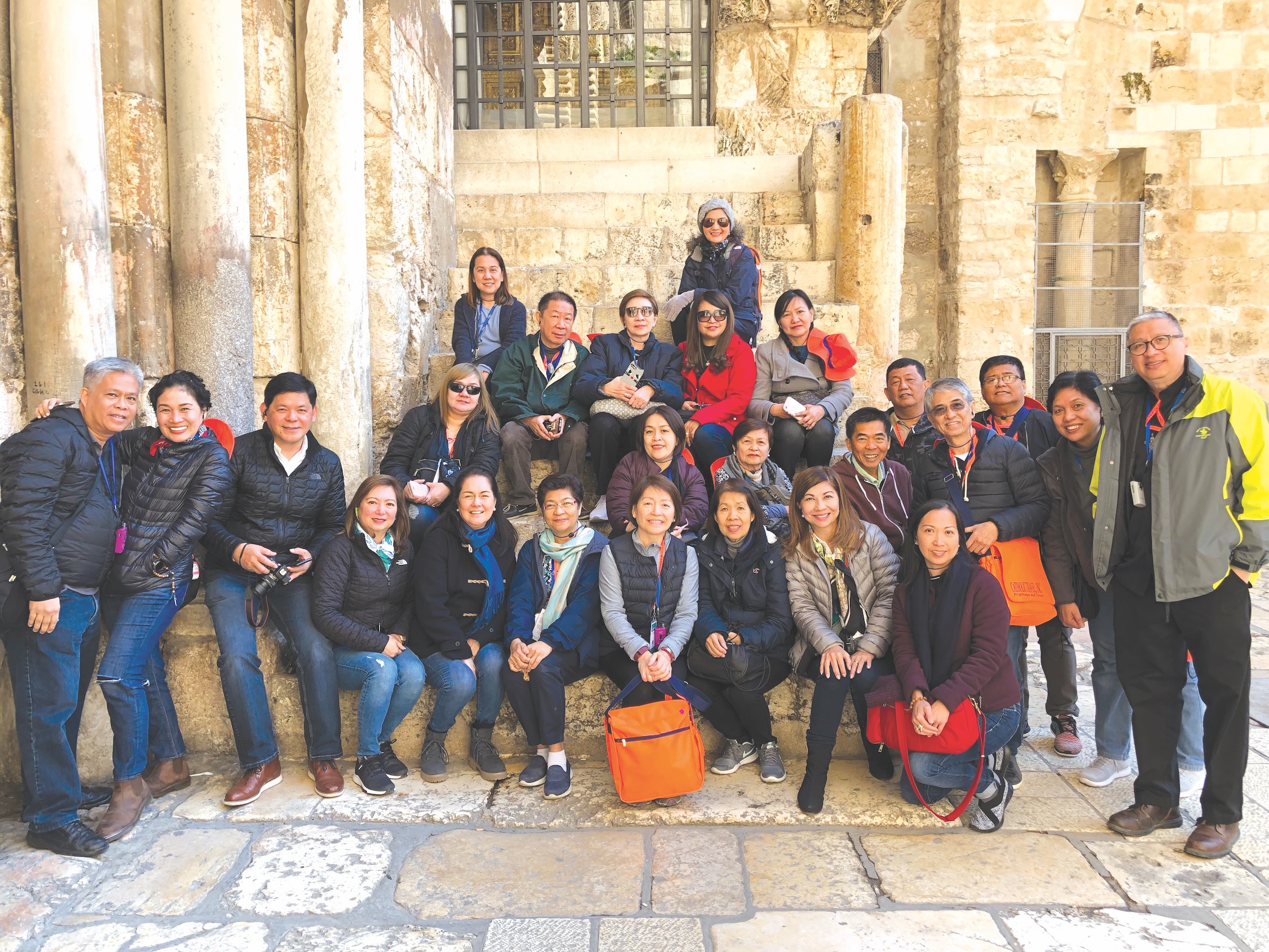 With Fr. Dave Concepcion (EXTREME RIGHT) in Jerusalem are (FRONT ROW, FROM LEFT) Benjie and Tata Uy, Ferdie and Tonette Castillo, Tina Maramba, Yoly Cheng, Andie Uy, Amy de Guzman, the author, Dr. Prescy Austero. (SECOND ROW) Dolly Perez, Gina Garcia, Leonor Uy, Ed Uy, Arnel Gonzales, Milo de Guzman, Fermin Santos, Adele Joaquin. (THIRD ROW) Norma Tinoco, Bebot Cheng, Mary Tan, Arlene Santamaria, Minda Gonzales and (TOP ROW) Carie Villena